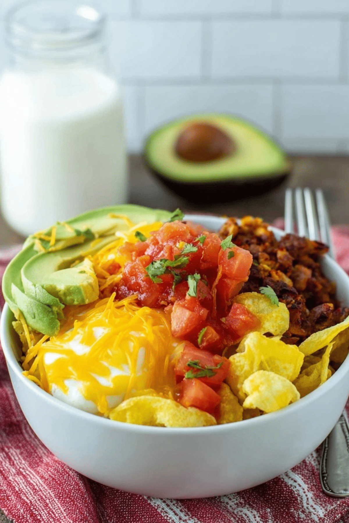 Breakfast Burrito Bowl with eggs, cheese, salsa, and avocado