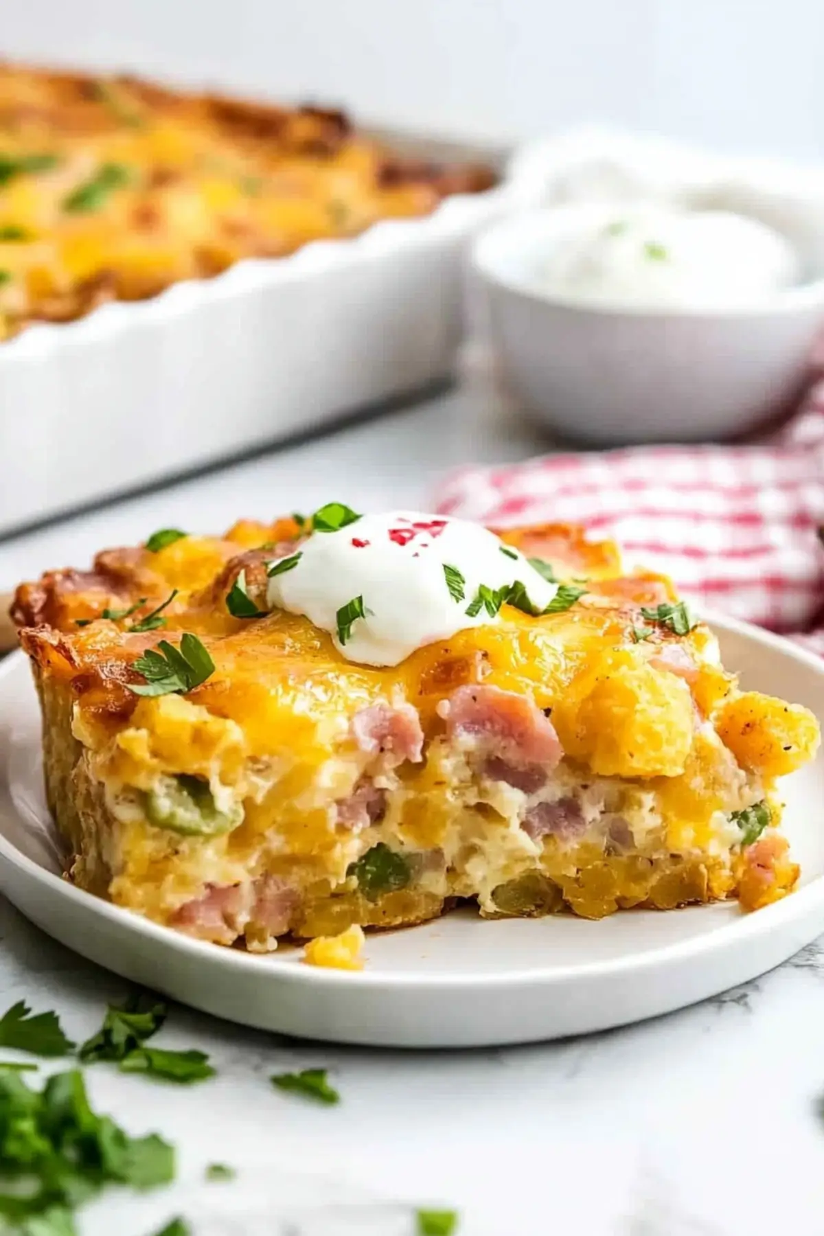Breakfast casserole with tater tots, cheese, and sausage.