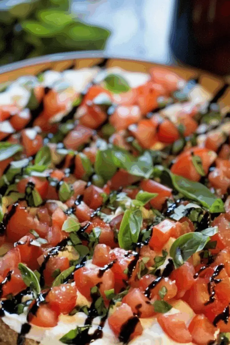 Bruschetta Dip appetizer with creamy cheese, tomatoes, and balsamic glaze"
