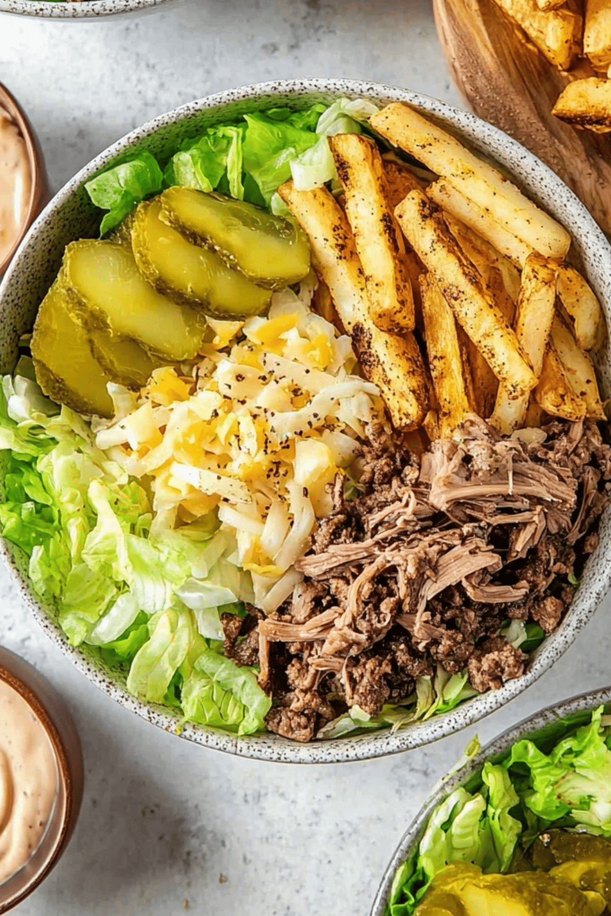 burger bowls with crispy potatoes, beef mince, lettuce, and homemade sauce