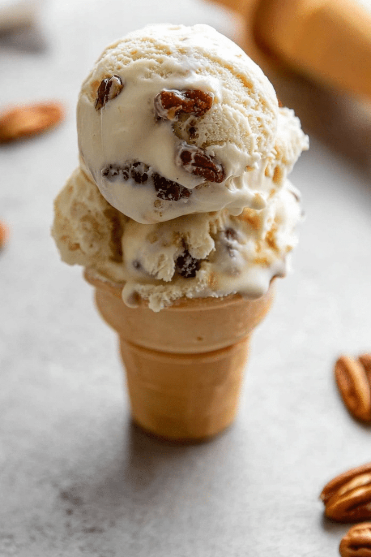 Homemade Butter Pecan Ice Cream served in a bowl with toasted pecans