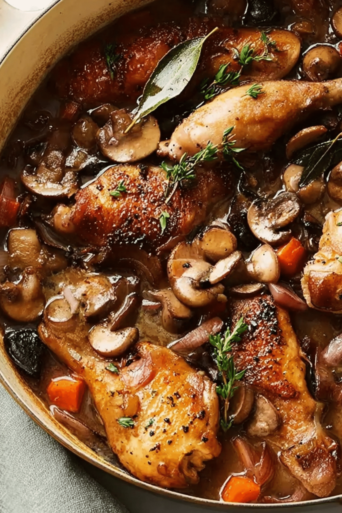 Ina Garten's Coq au Vin recipe with chicken, bacon, and wine sauce