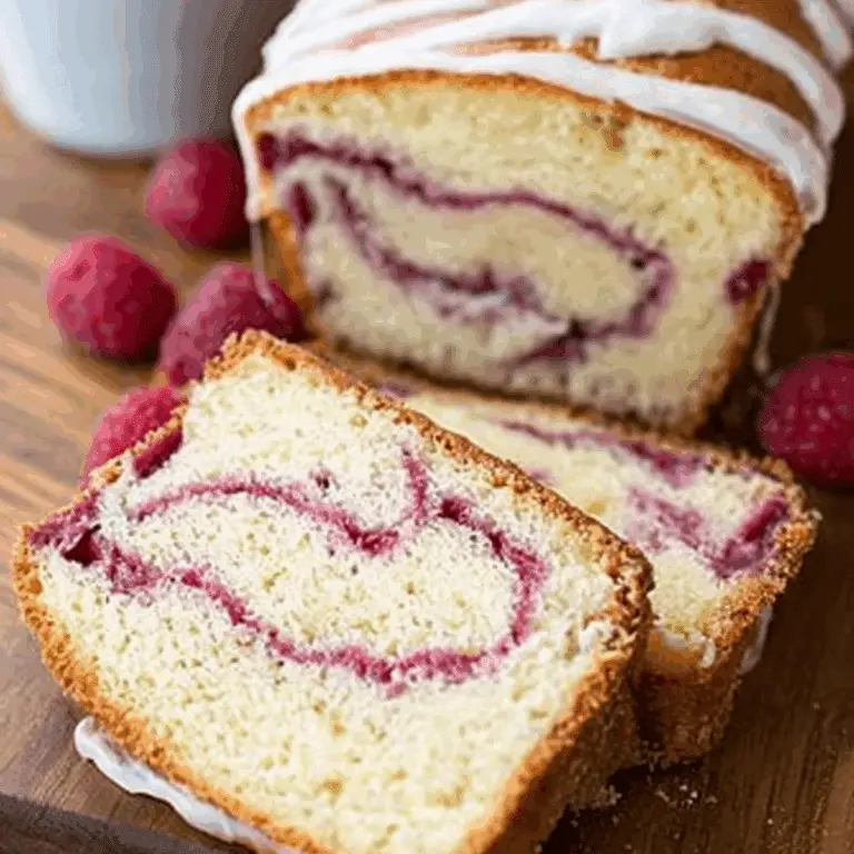 Yogurt Cake with Raspberry Swirl topped with creamy yogurt glaze