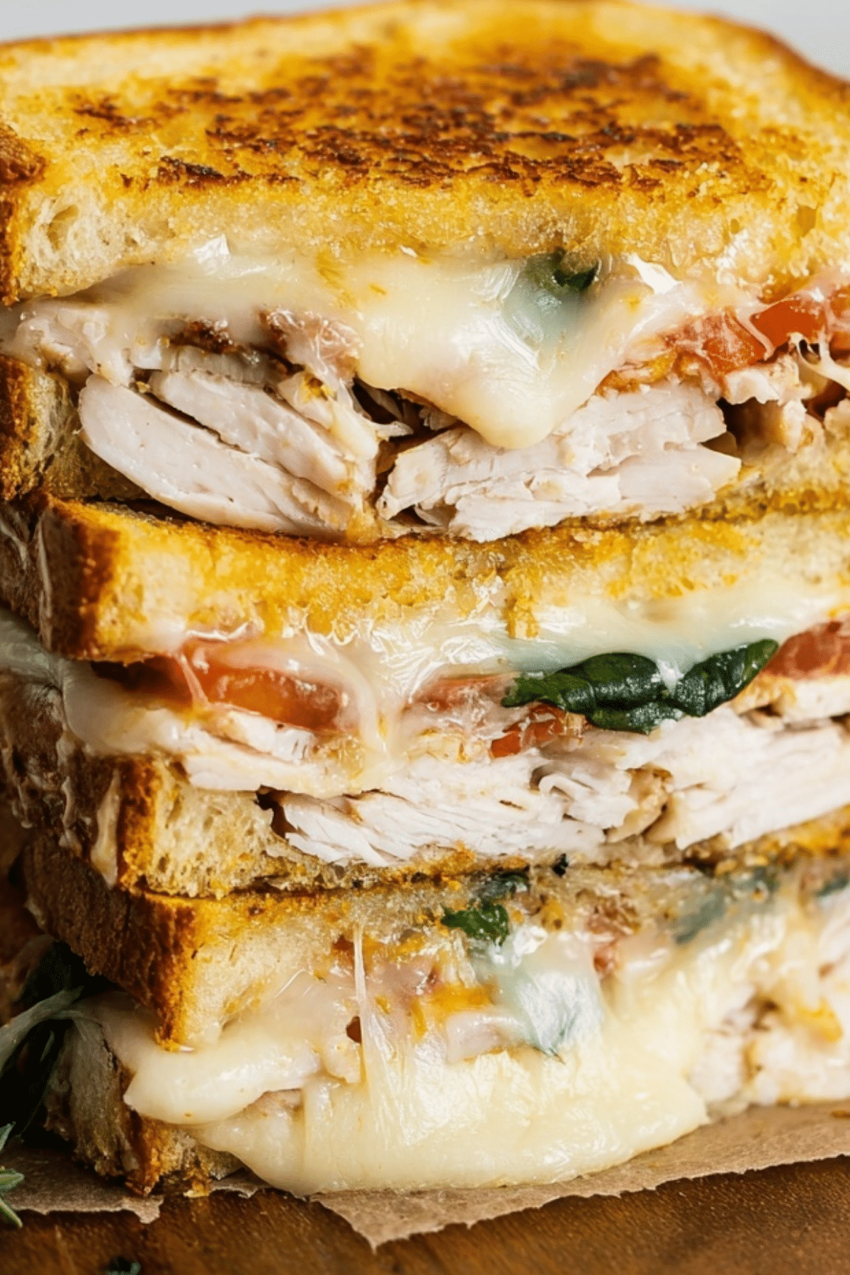 Turkey Melt with Cheddar, Spinach, and Bacon on sourdough bread