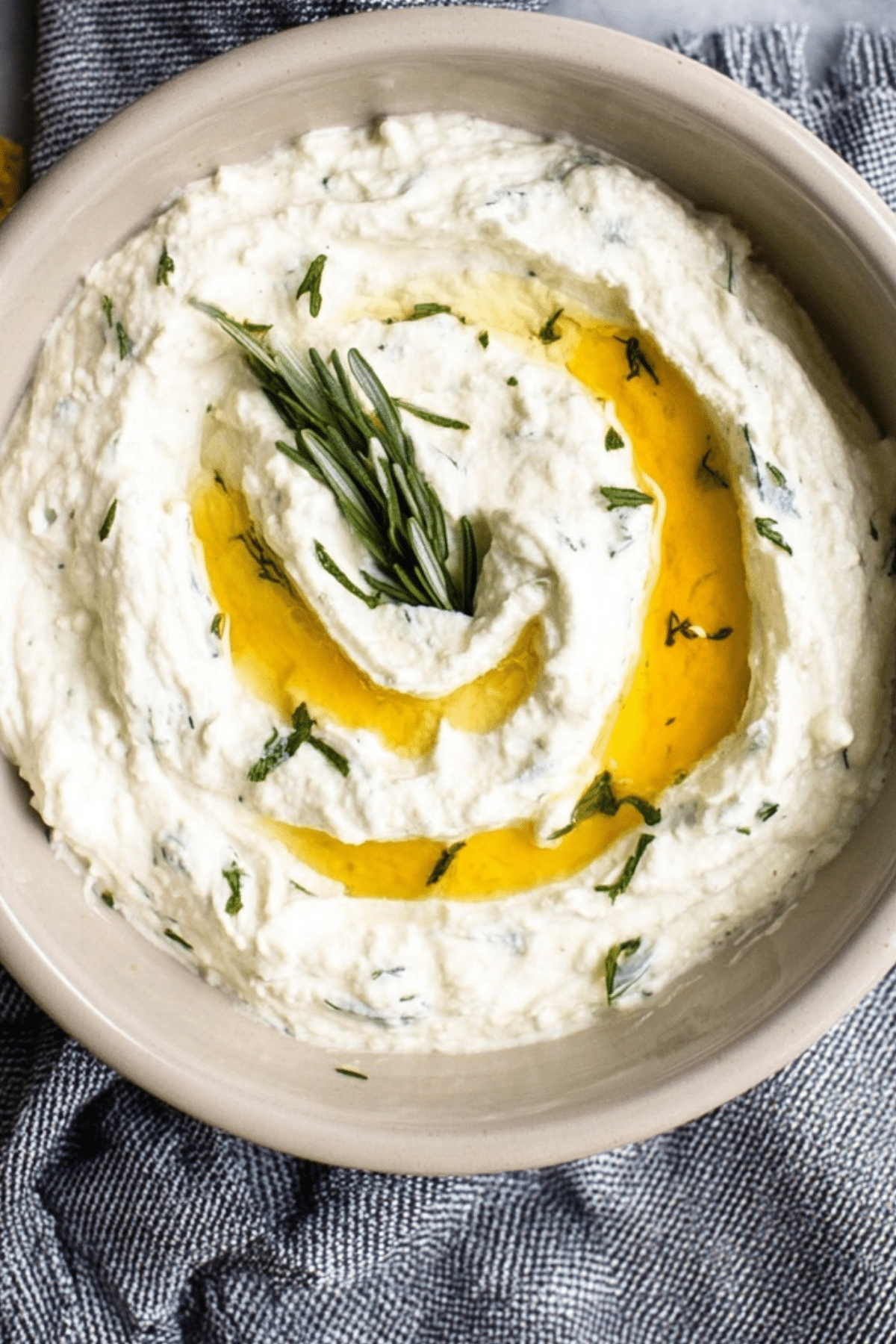 Whipped Ricotta Dip served with fresh herbs and crackers