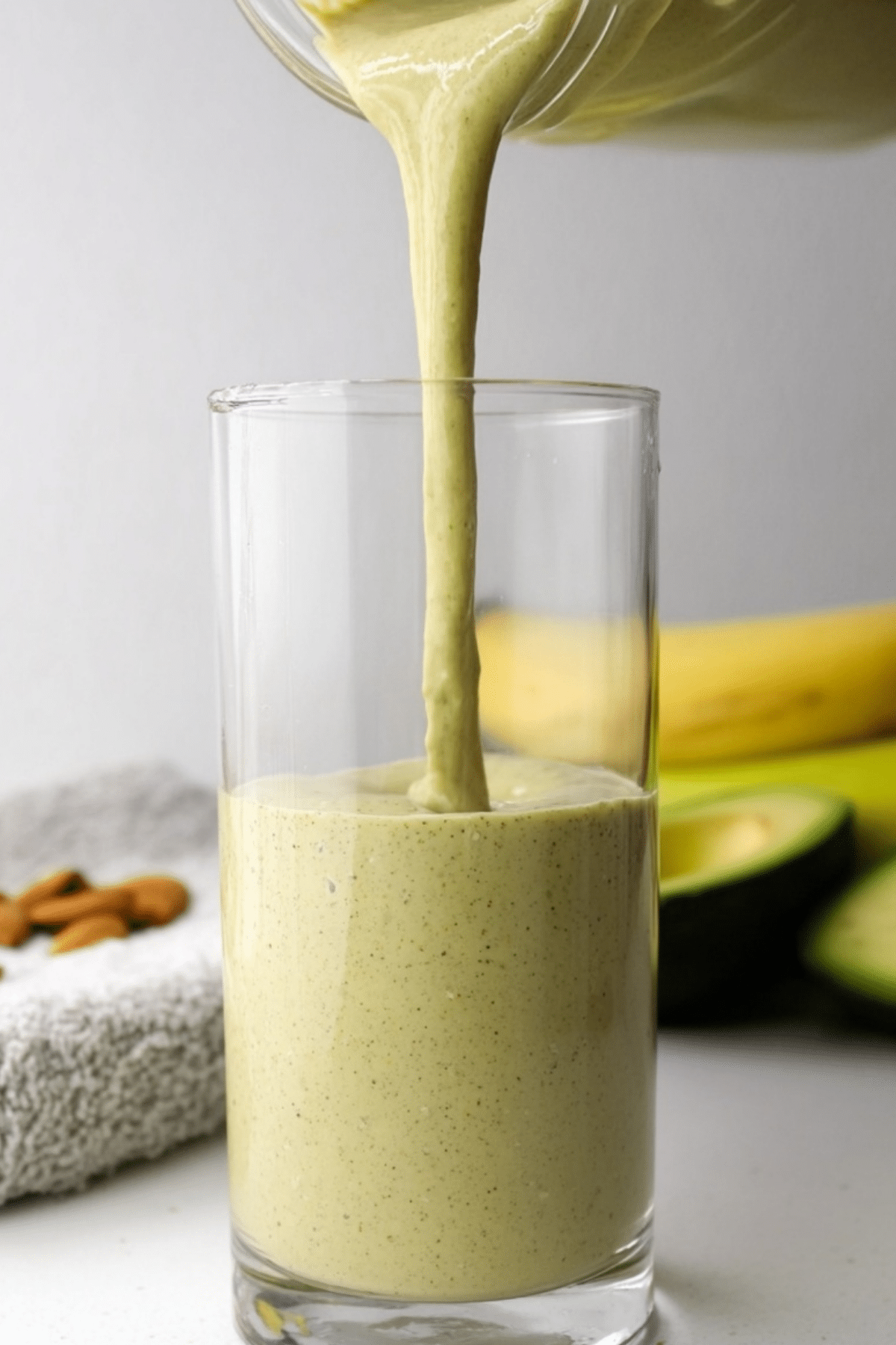 banana avocado almond milk smoothie in glass
