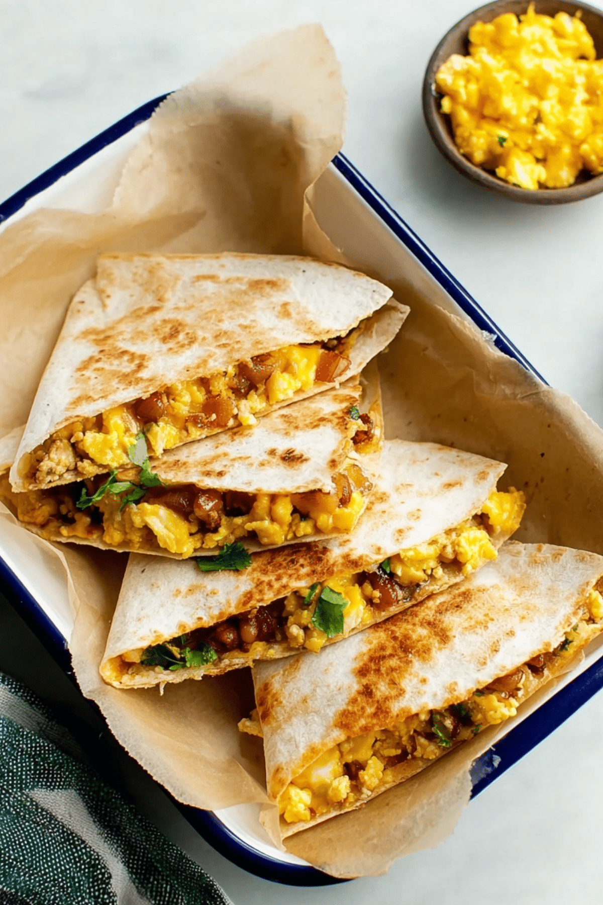 Breakfast Quesadillas with scrambled eggs, beans, and cheese"