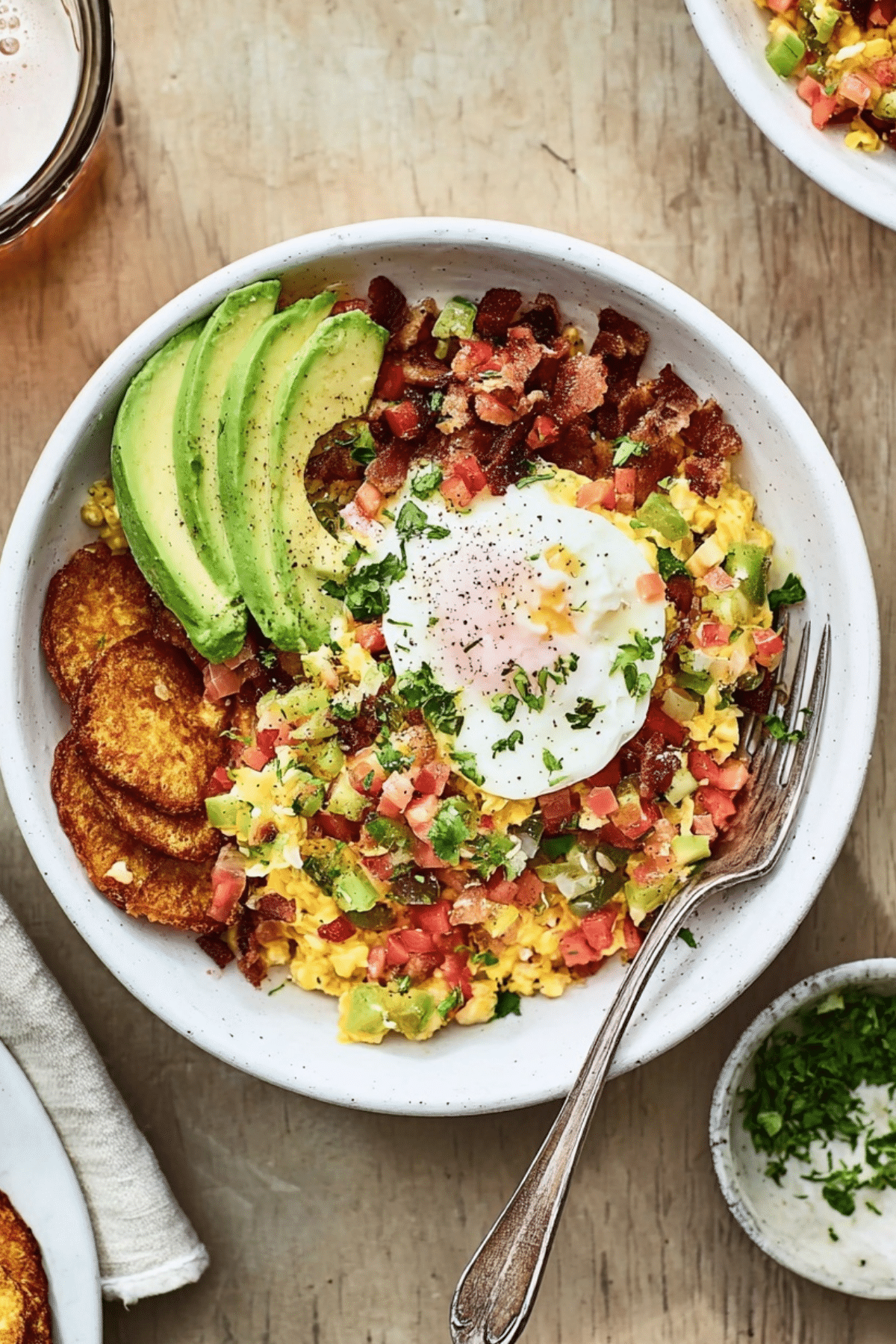 High protein breakfast bowls with eggs, bacon, avocado, and Greek yogurt