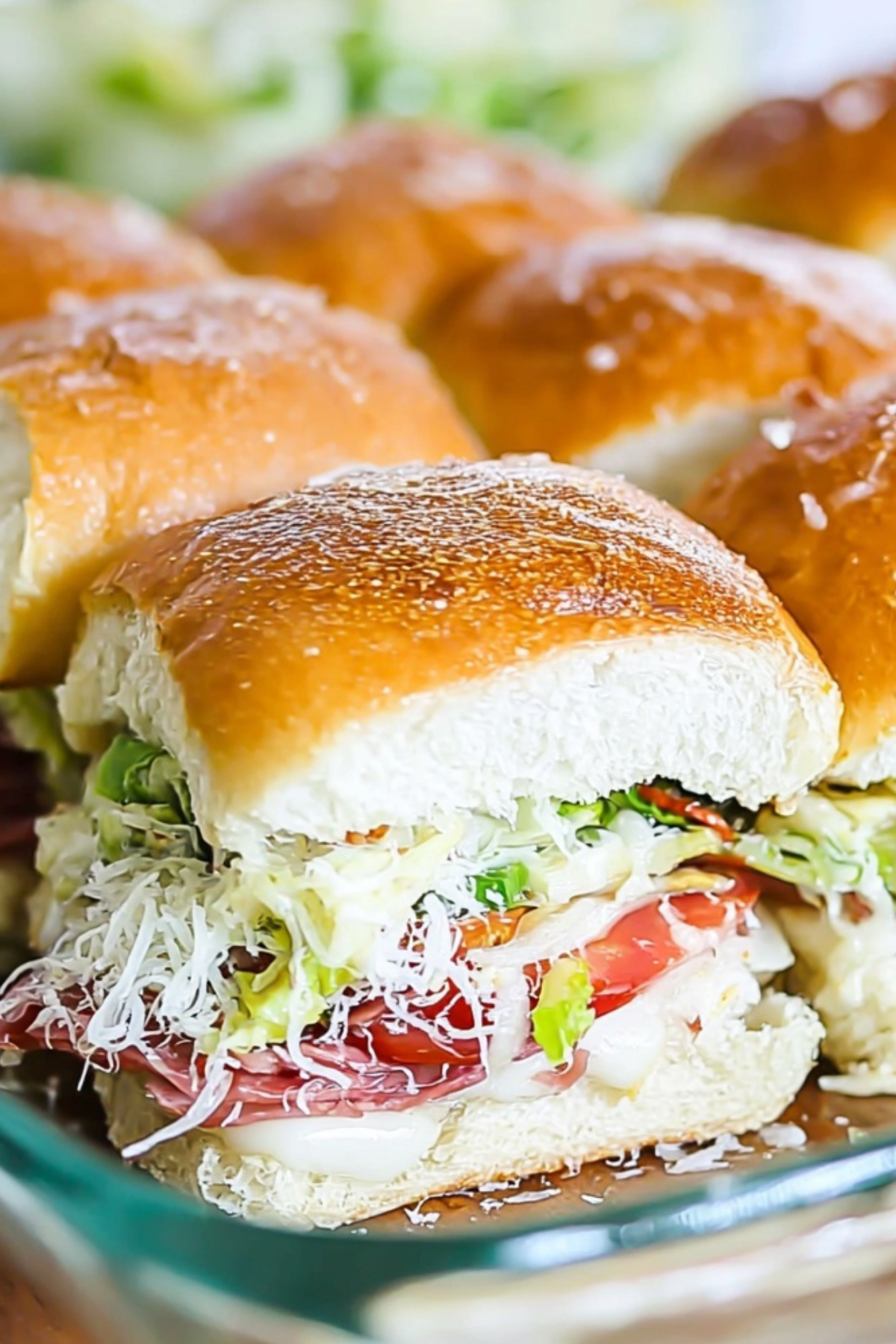 Italian Grinder Sliders with meats, cheese, and tangy salad on Hawaiian rolls
