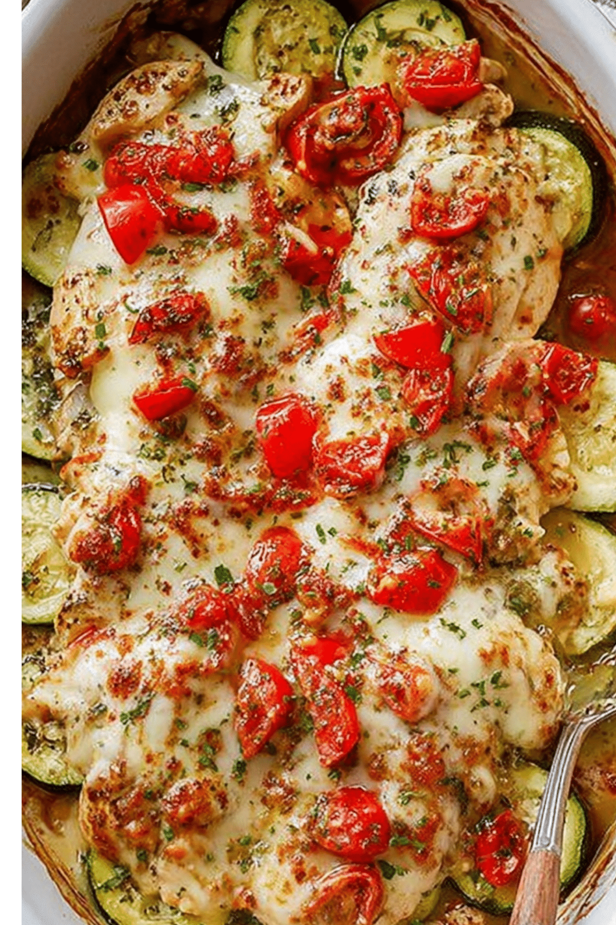 Mediterranean Chicken Zucchini Bake with cheese and veggies in a baking dish