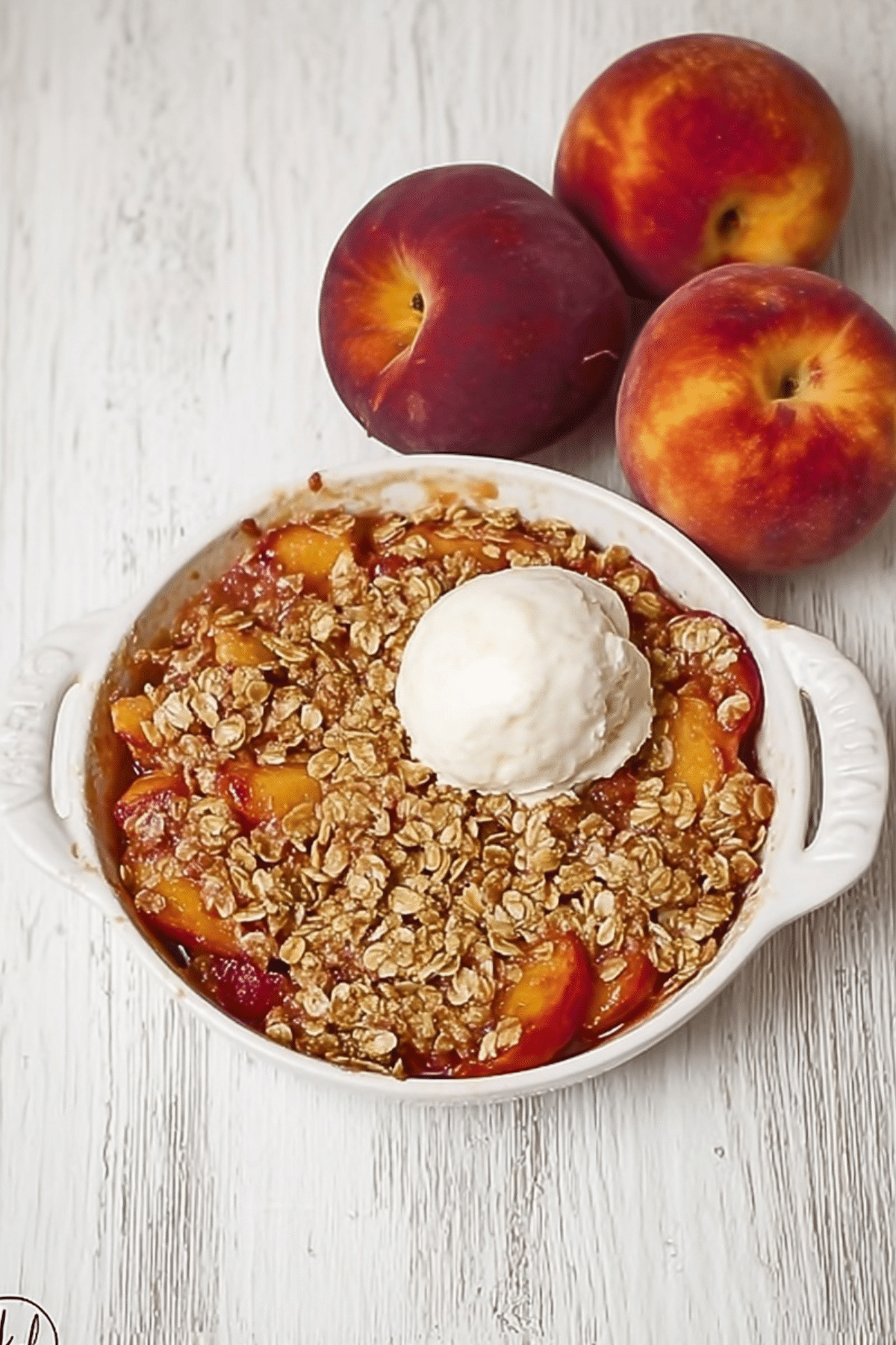 nectarine crisp with cinnamon oat topped with golden streusel