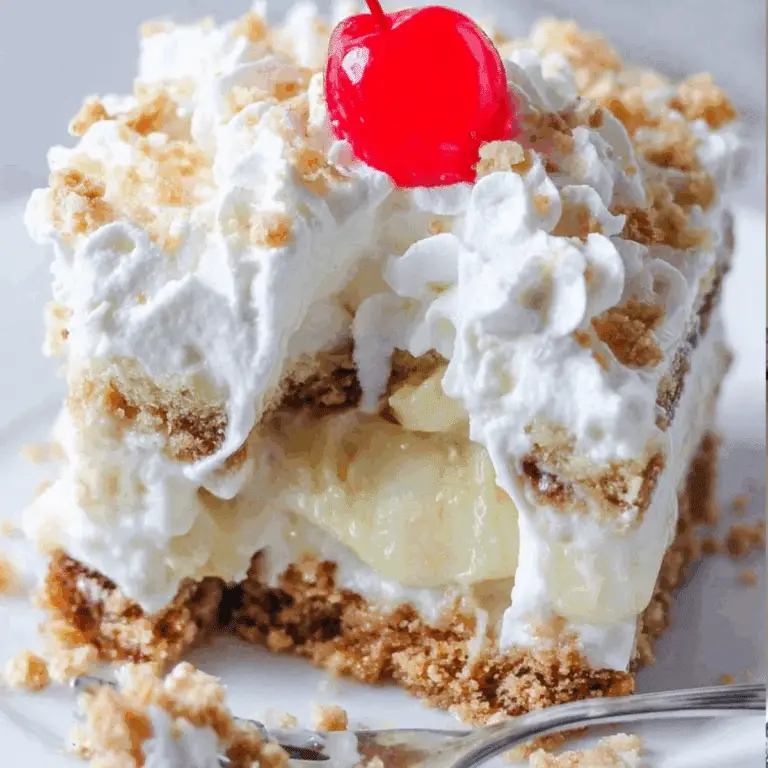 No Bake Banana Split Cake with graham cracker crust, bananas, pineapple, and whipped topping