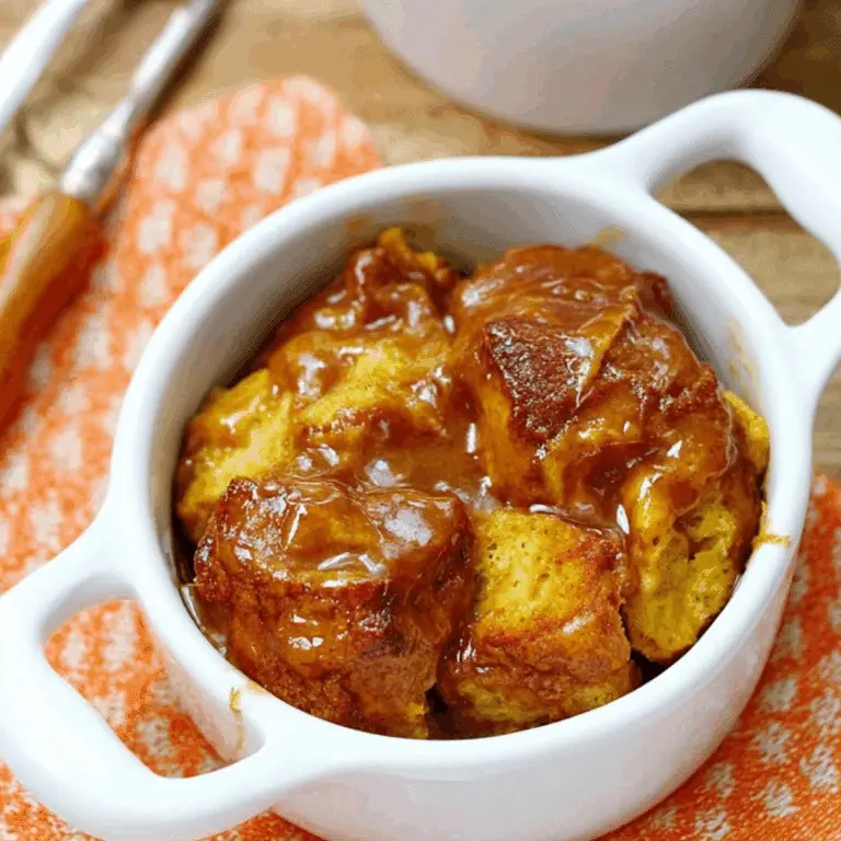 Pumpkin Bread Pudding with brown sugar sauce and whipped cream