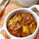 Pumpkin Bread Pudding with brown sugar sauce and whipped cream