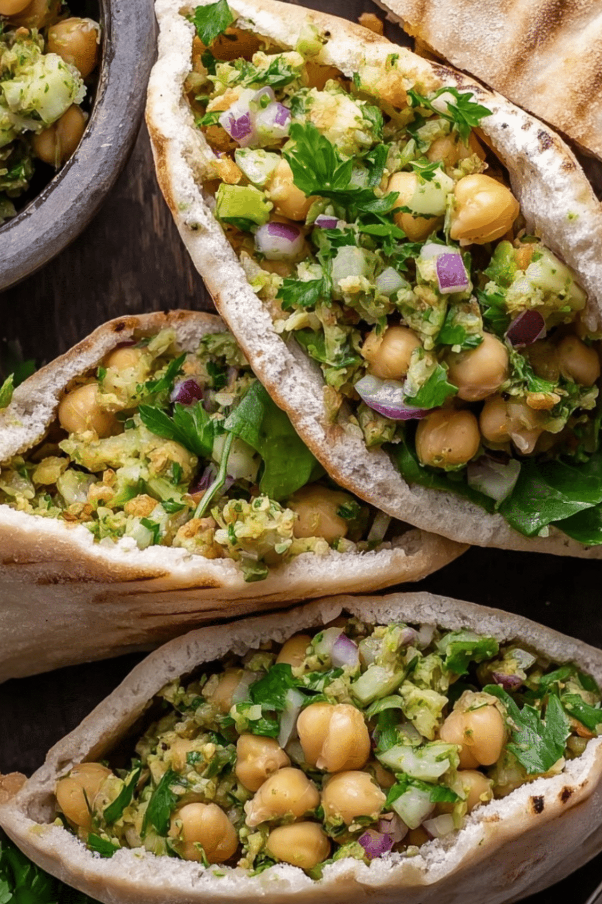 Smashed Chickpea Salad Stuffed Pitas with creamy avocado and fresh herbs