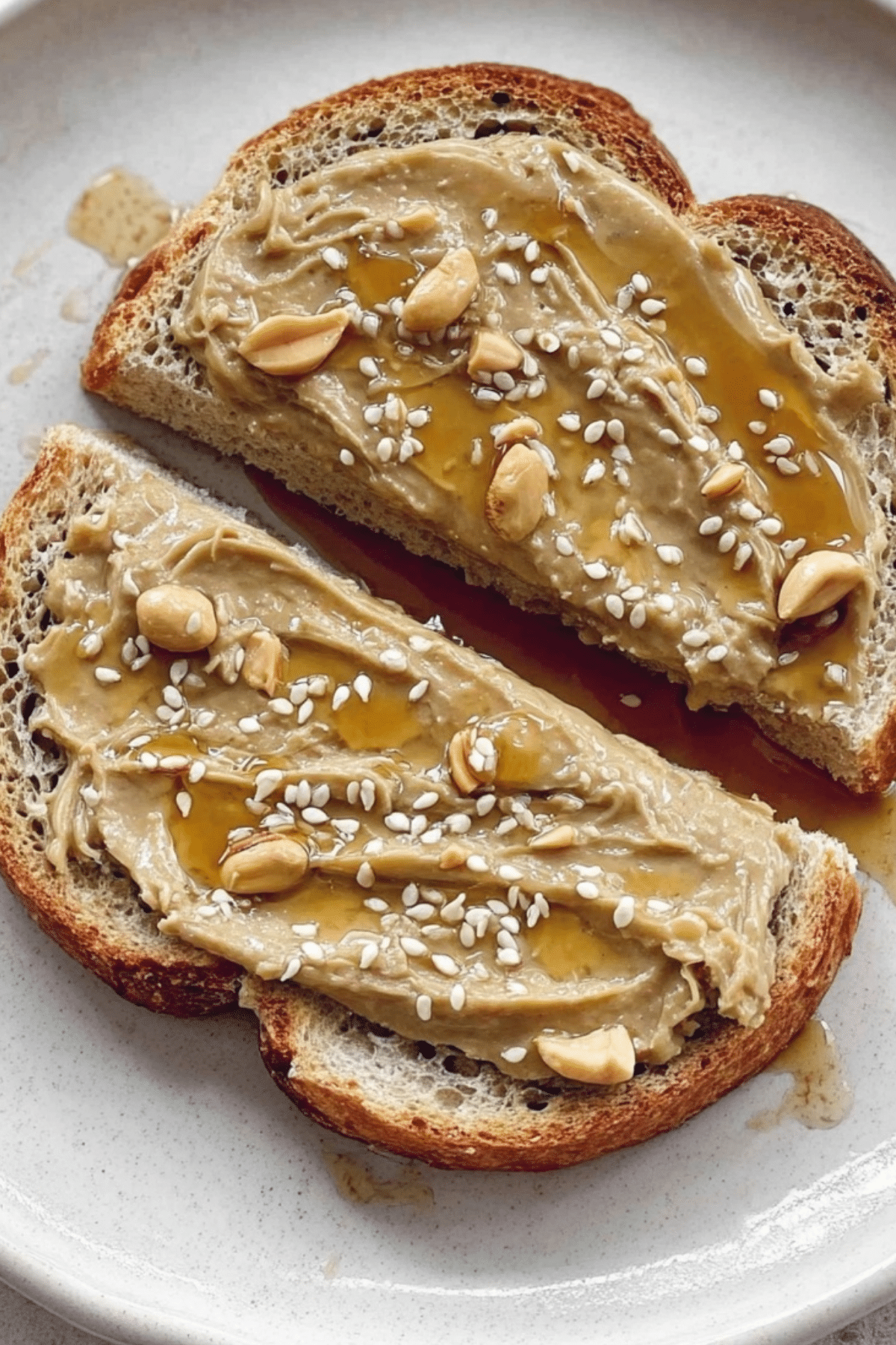 Tahini Honey Toast topped with sesame seeds and honey drizzle