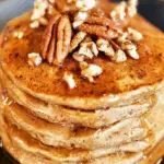 Apple Butter Pancakes served with syrup and nuts