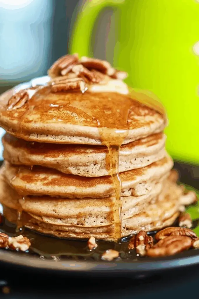 Apple Butter Pancakes served with syrup and nuts