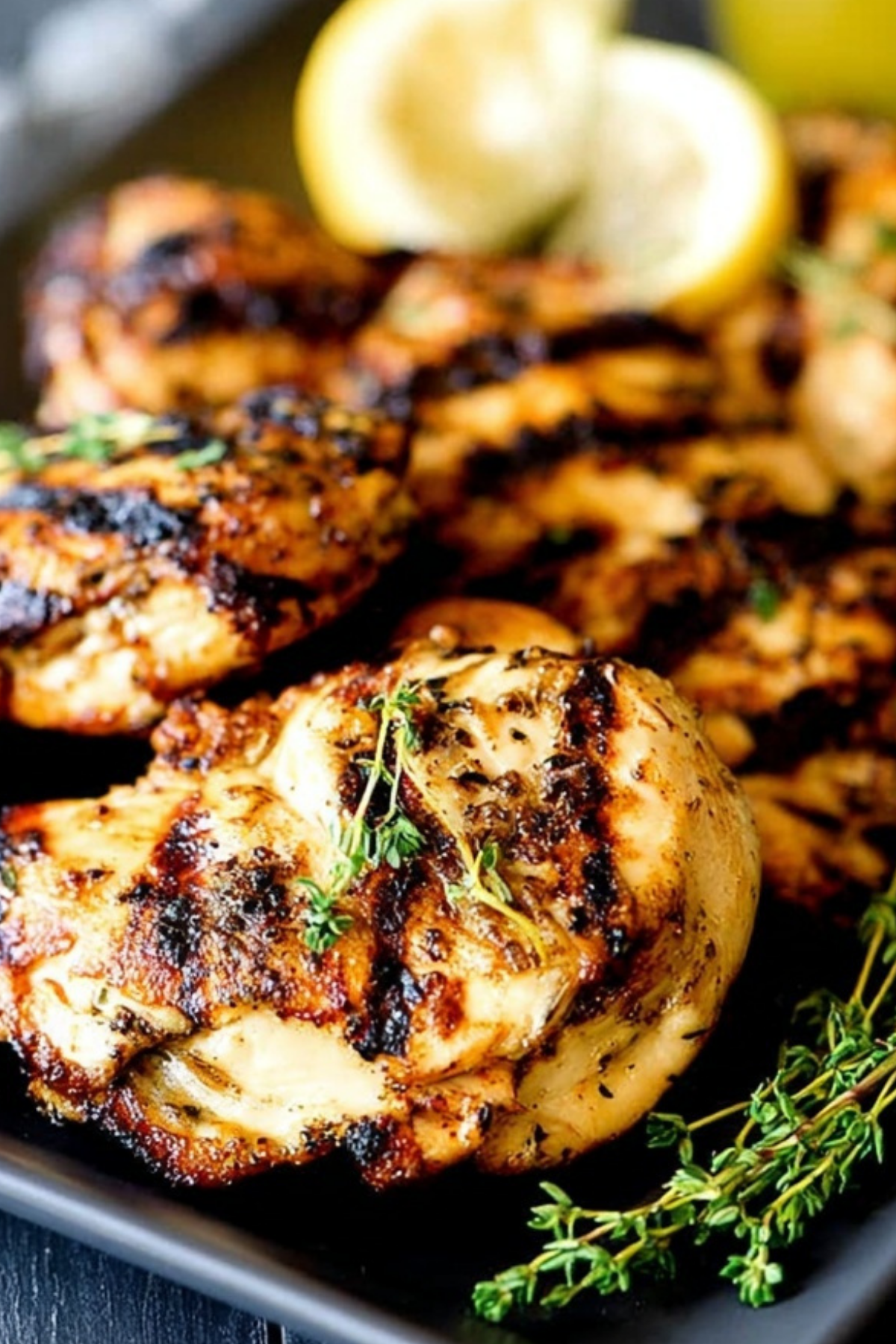 Apple Cider Thyme Grilled Chicken on the grill