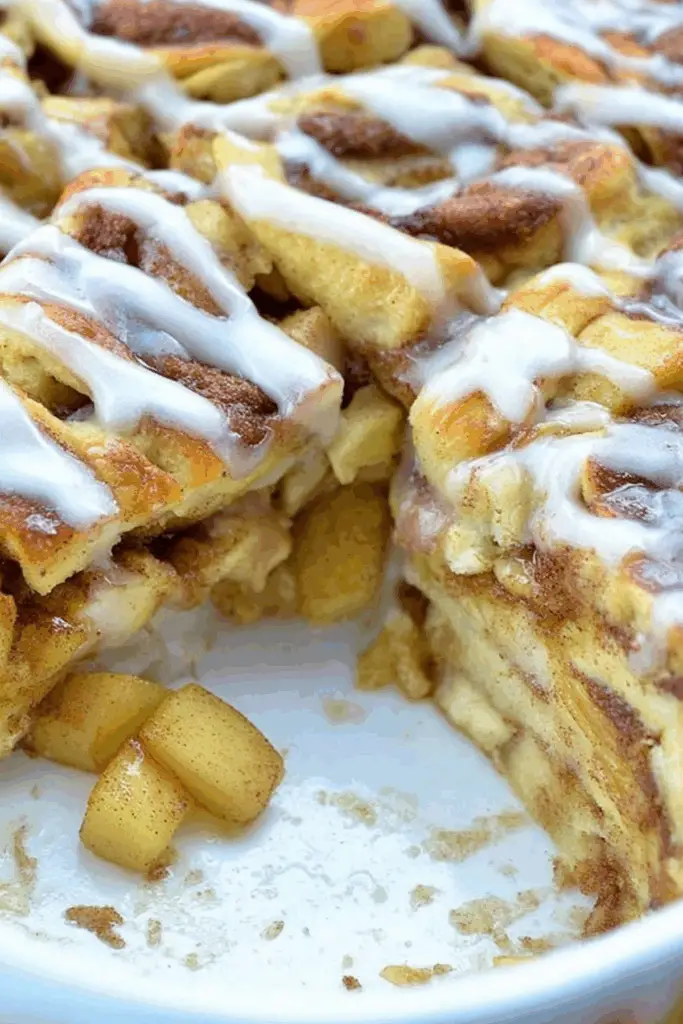 Caramel Apple Cinnamon Roll Lasagna served warm with caramel drizzle