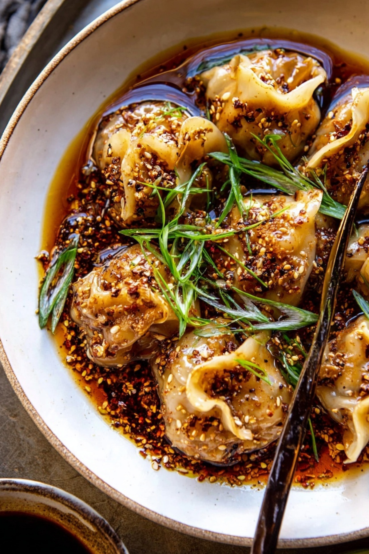 chili crisp butternut squash dumplings served in ginger soy broth