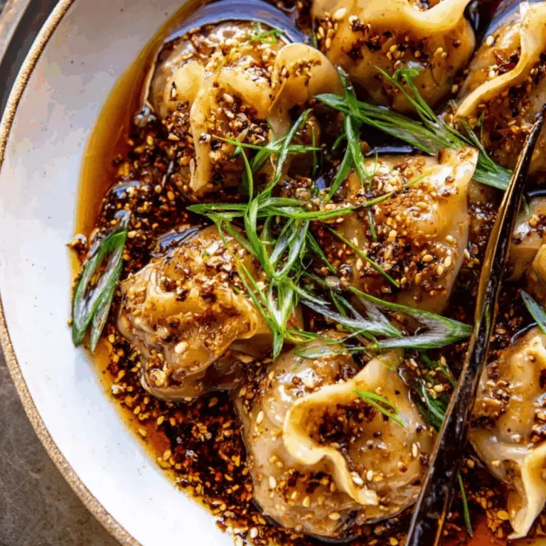chili crisp butternut squash dumplings served in ginger soy broth
