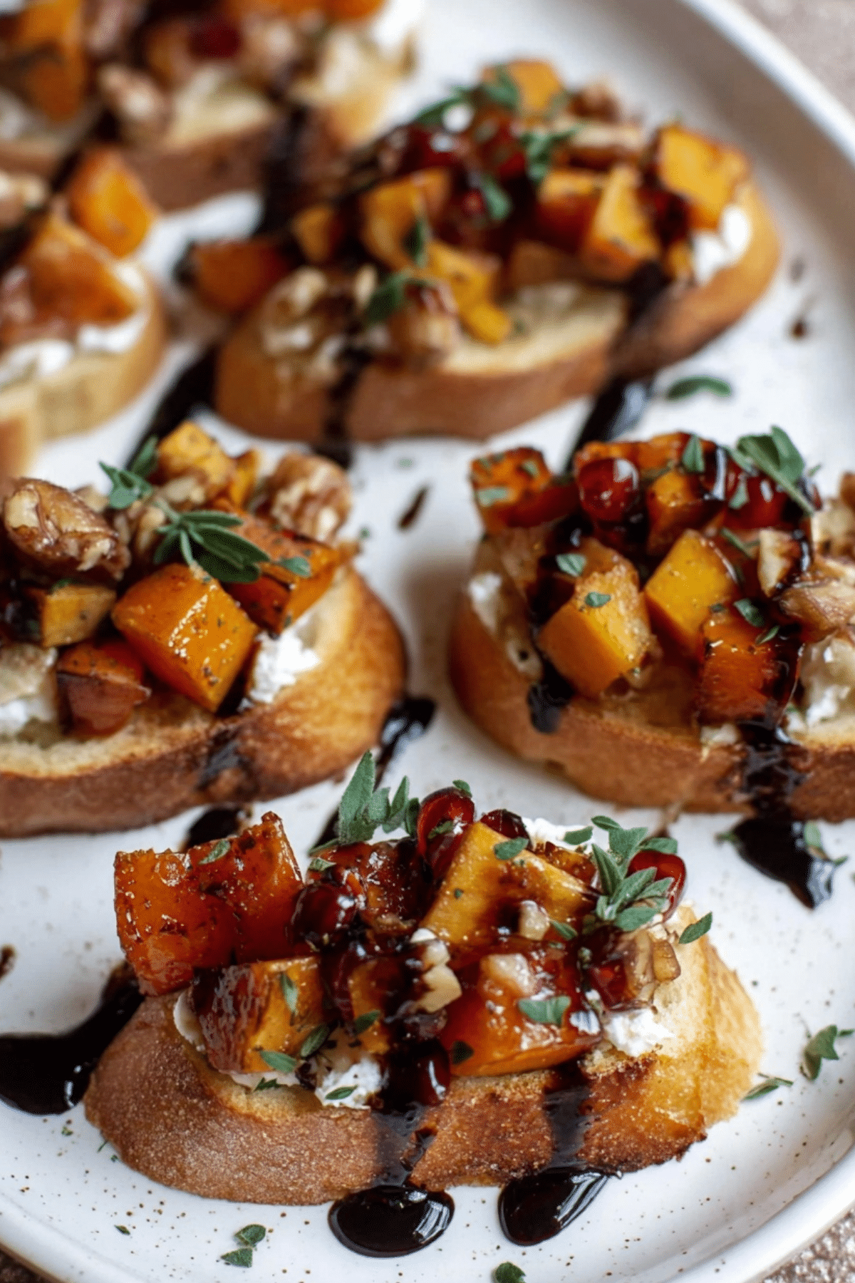 fall bruschetta with roasted butternut squash, apples, and goat cheese