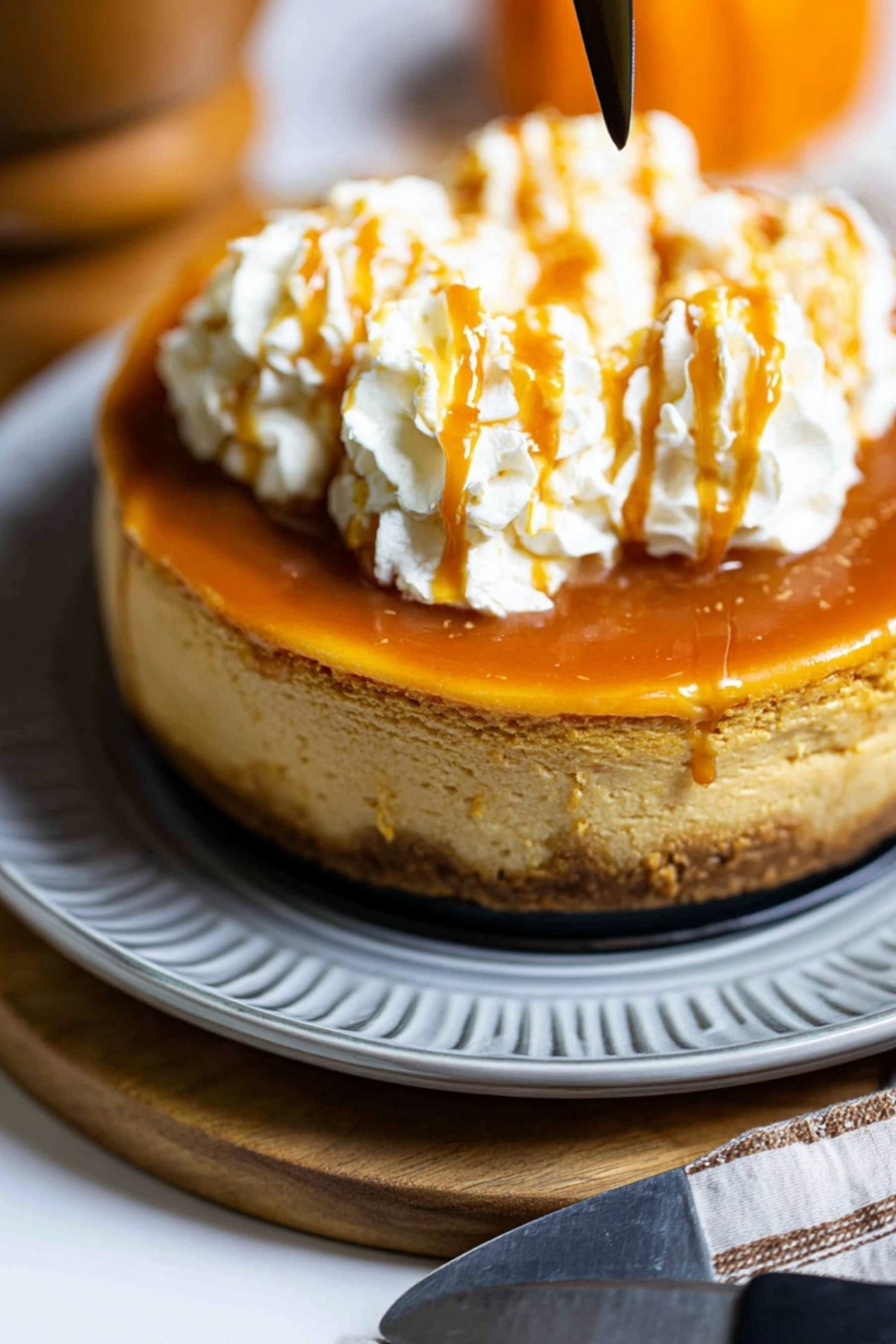 Pumpkin Caramel Cheesecake topped with homemade caramel sauce