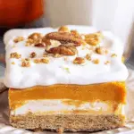 Pumpkin Delight layered dessert with pecans and whipped topping