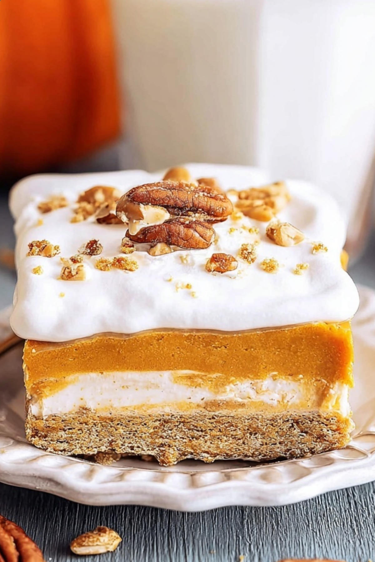 Pumpkin Delight layered dessert with pecans and whipped topping