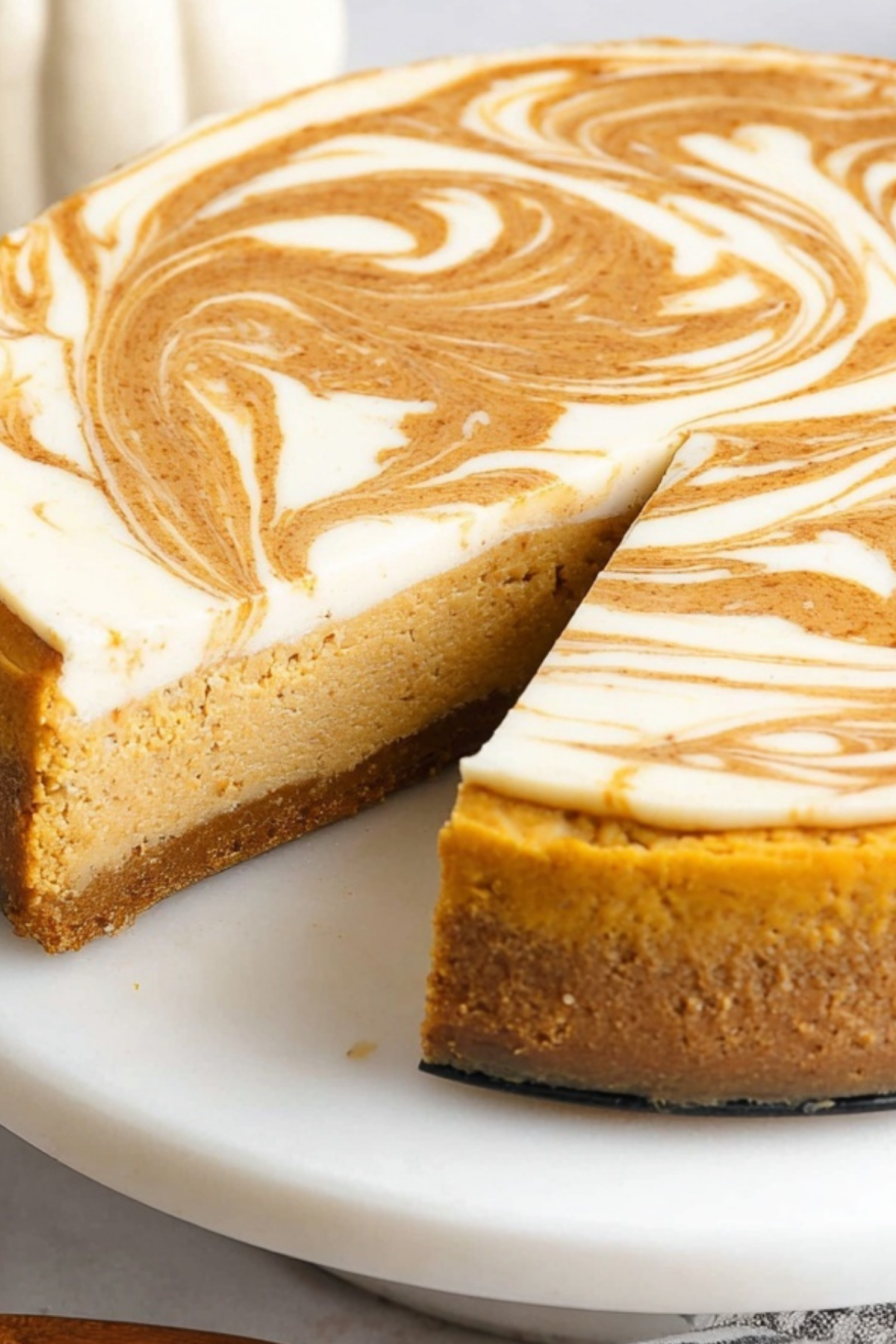 pumpkin swirl cheesecake with a creamy texture and fall spices