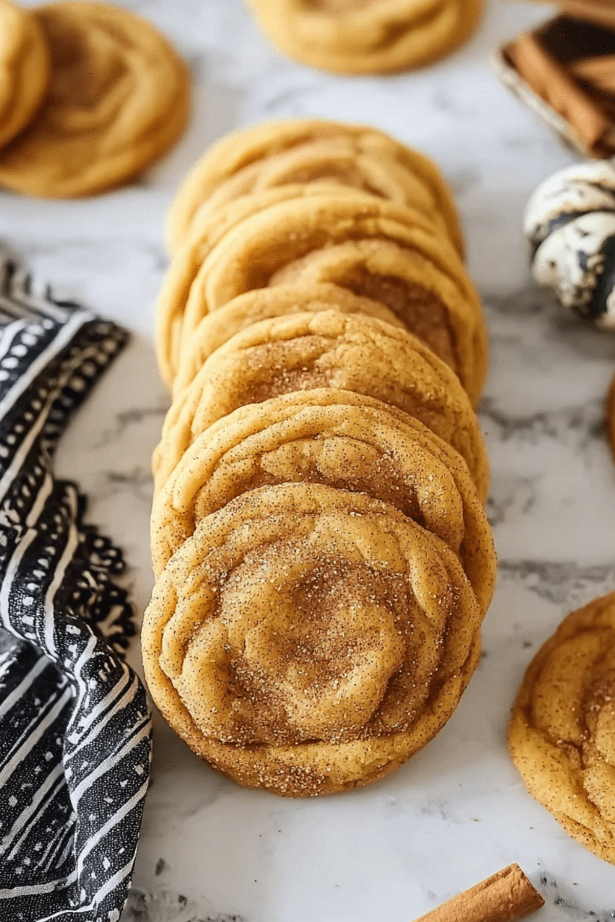 Pumpkindoodle Cookies on baking tray with cinnamon sugar coating