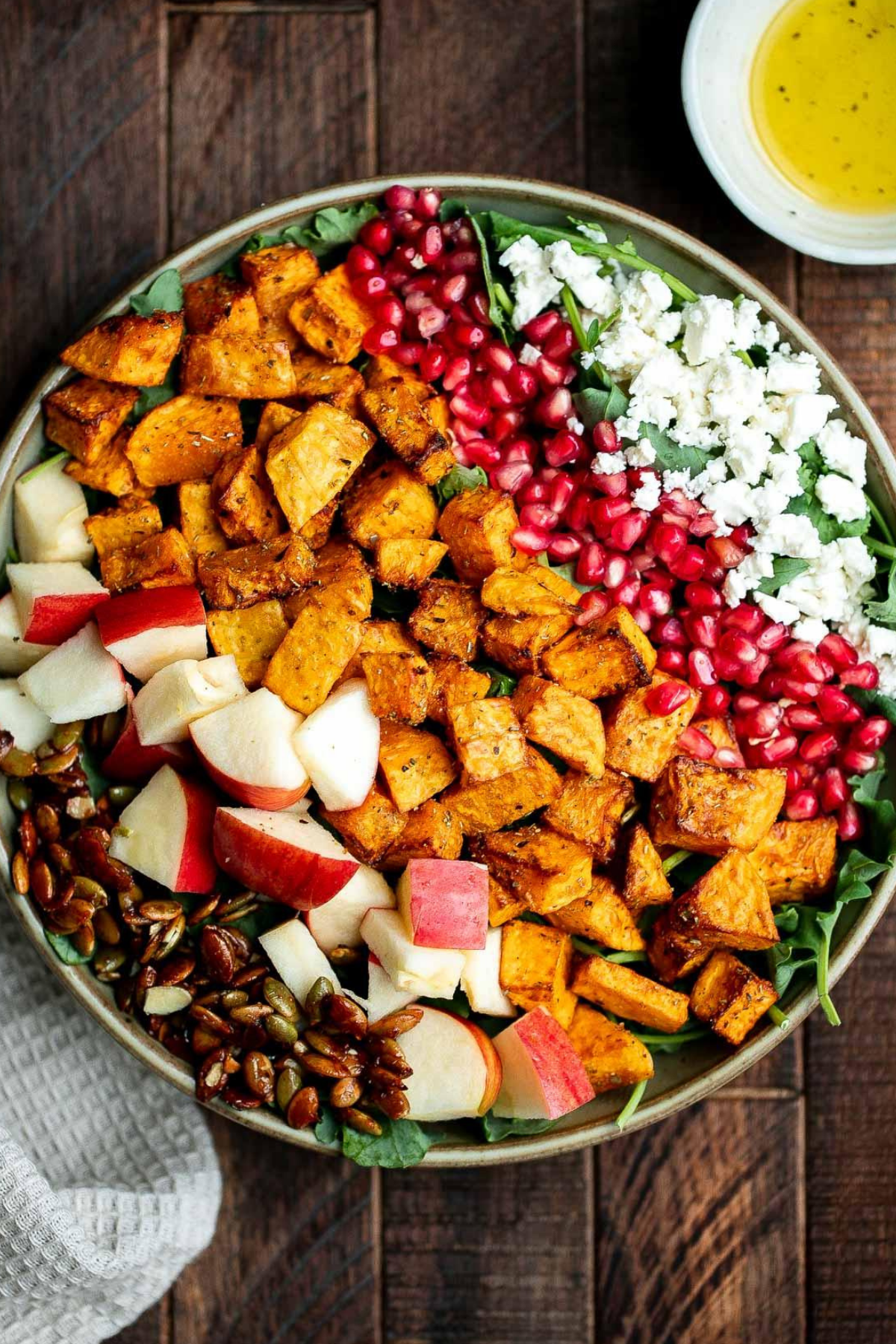 Salad with Butternut Squash and Apple served in a bowl with greens