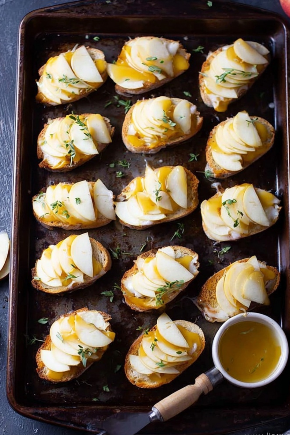 Smoked Gouda & Apple Crostini topped with thyme and honey drizzle