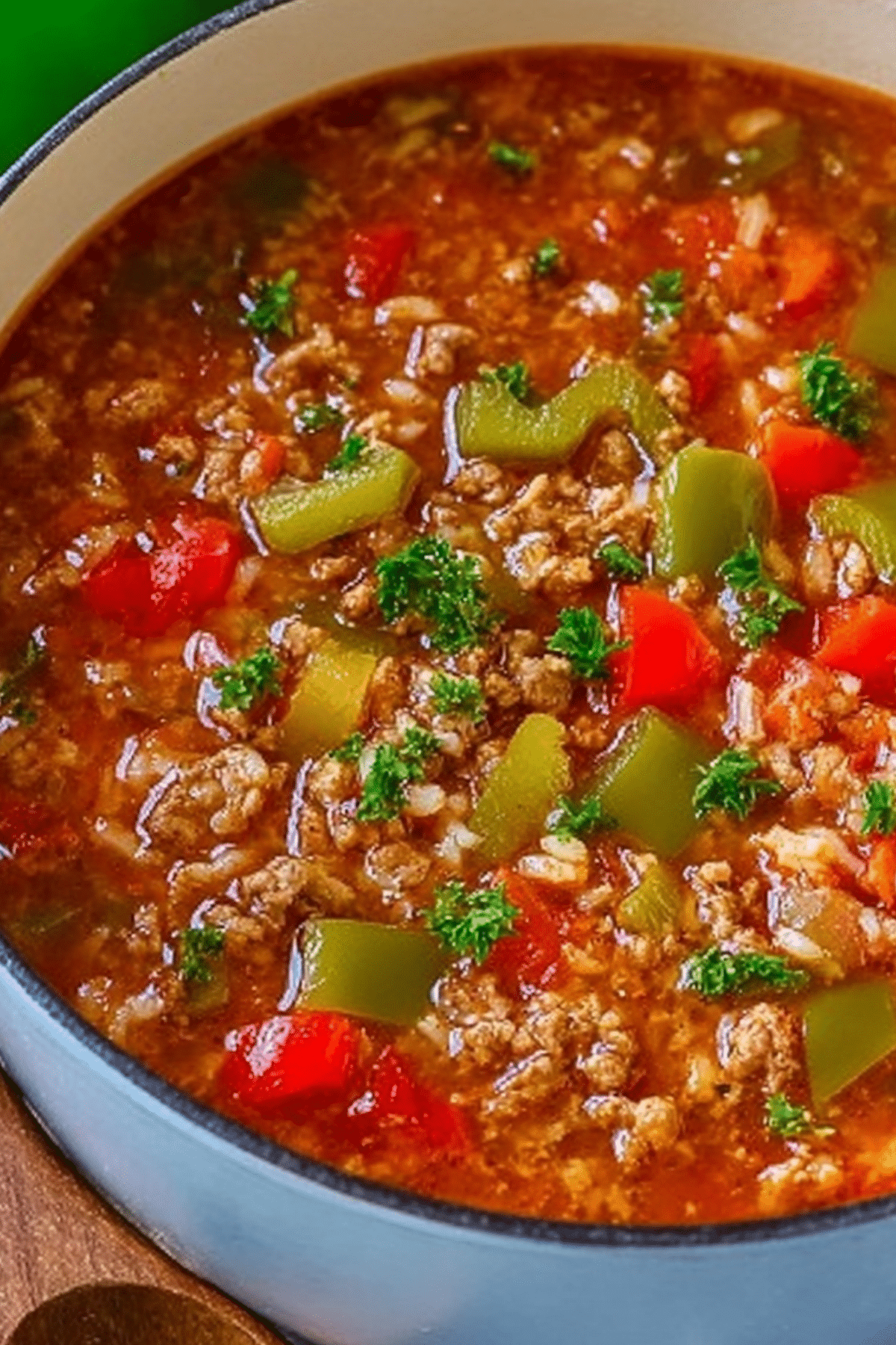 Delicious stuffed pepper soup with ground beef, rice, and bell peppers in a savory broth.