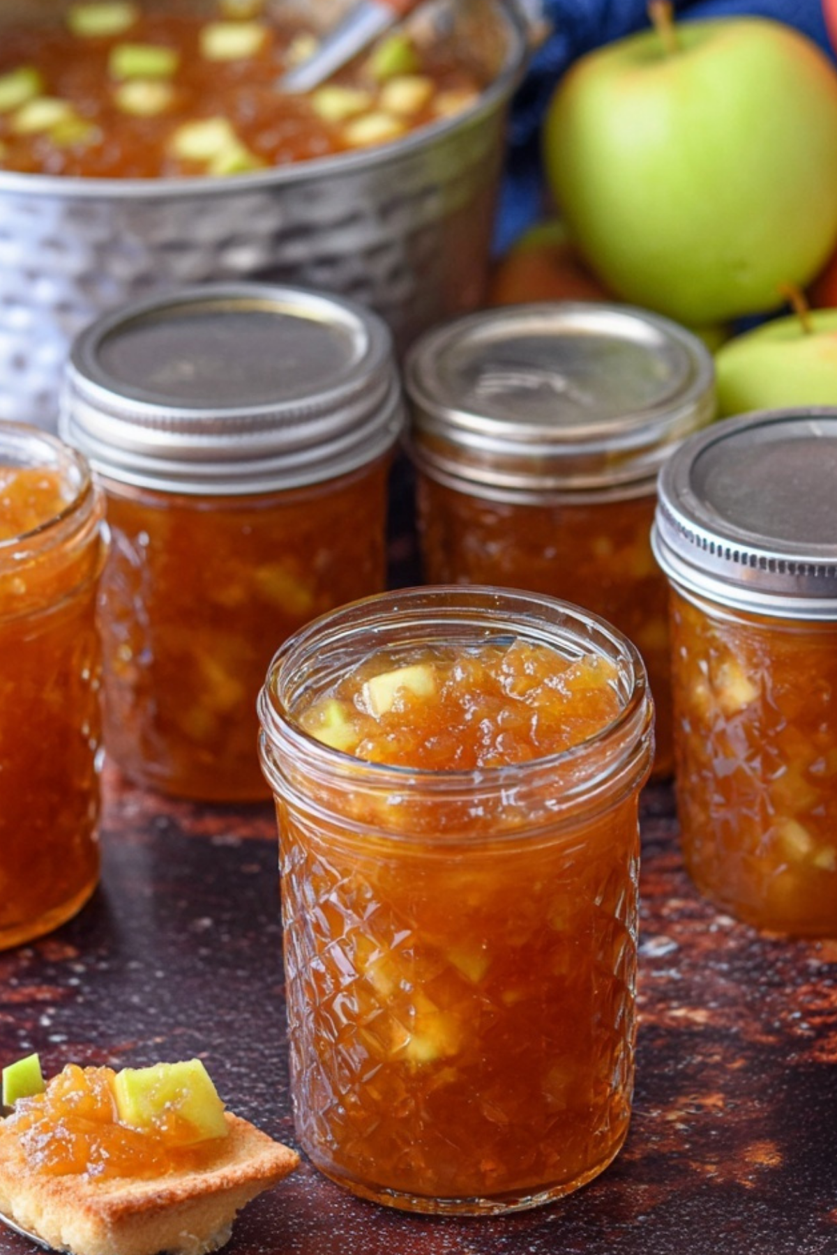Homemade Apple Pie Jam in jar with cinnamon sticks
