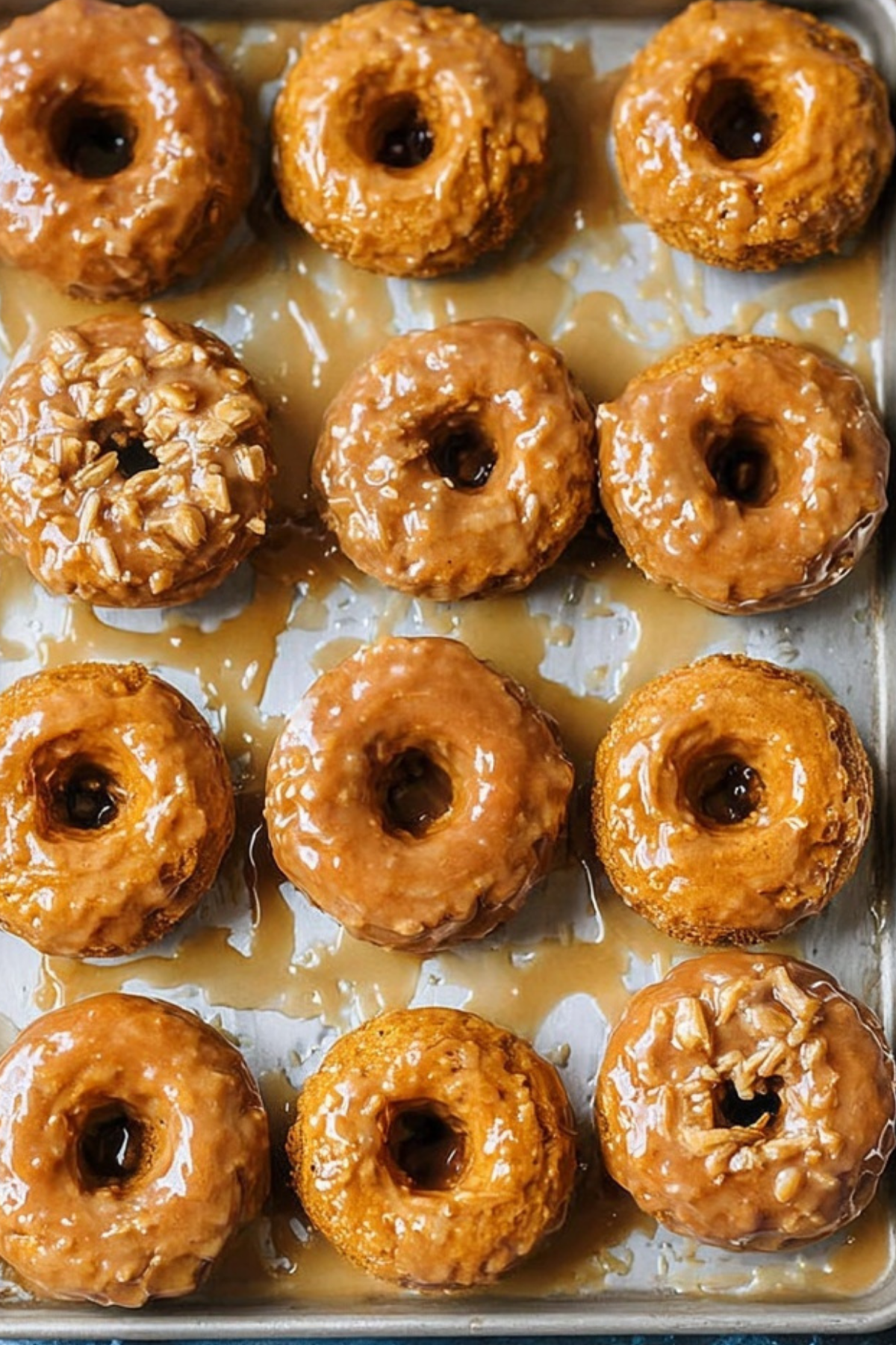 baked pumpkin donuts with maple glaze on cooling rack