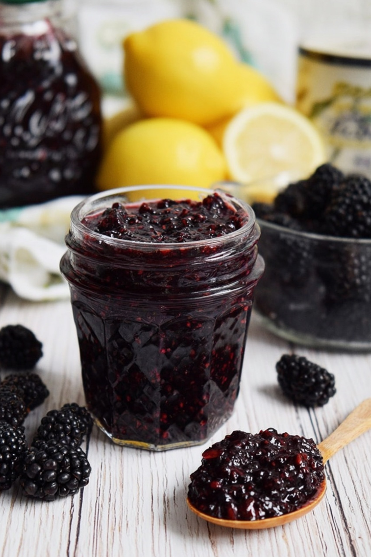 Blackberry Vanilla Bourbon Jam in glass jar with spoon