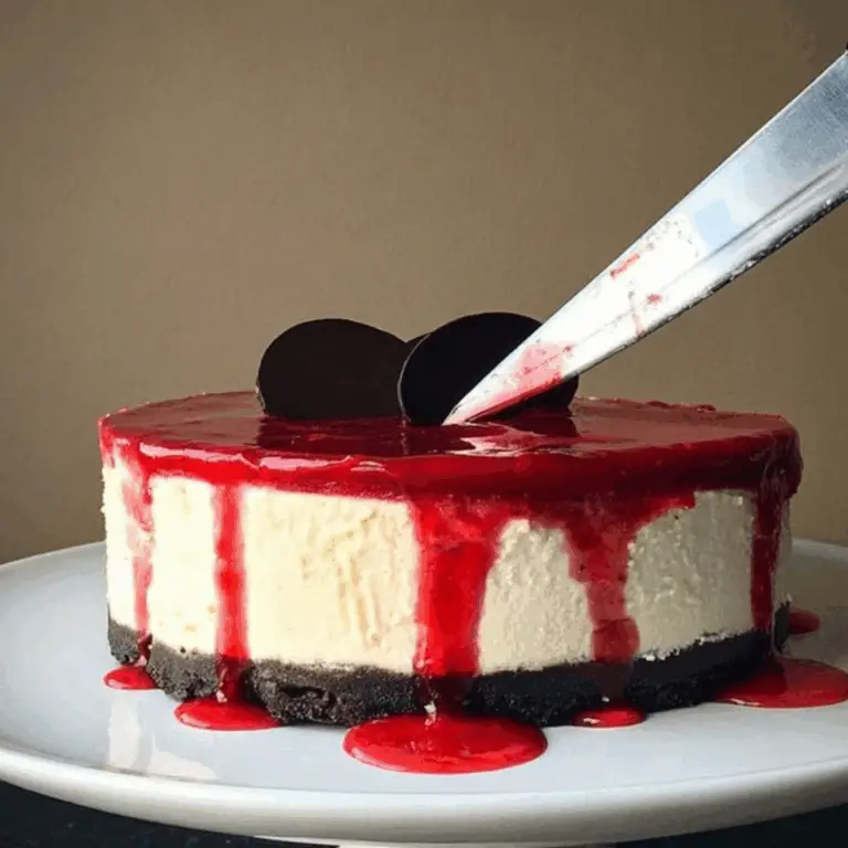 Bloody Good Halloween Cheesecake with chocolate cookie base and red drip effect