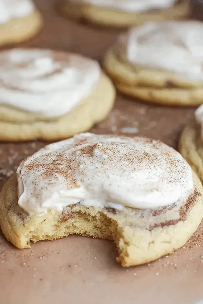 freshly baked cinnamon roll cookies with cream cheese frosting
