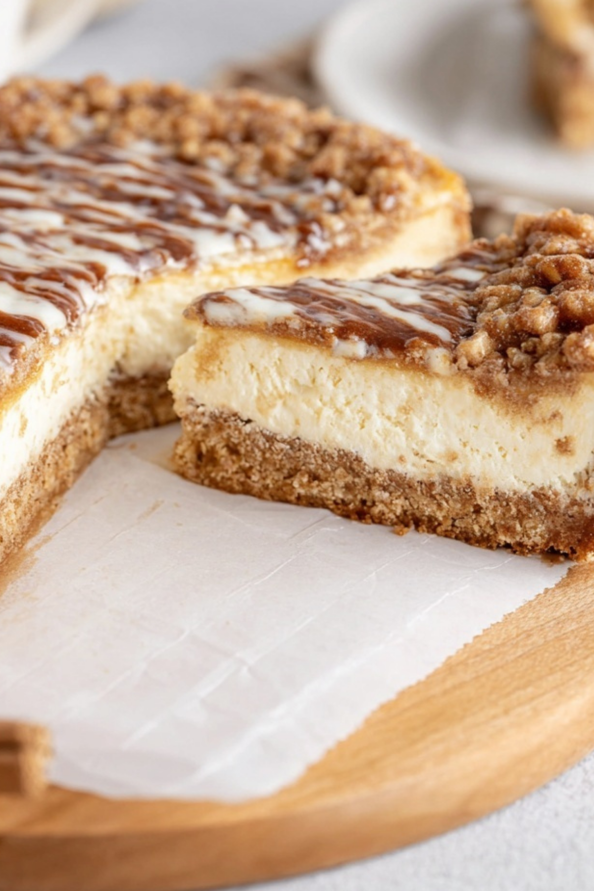 Slice of creamy Coffee Cake Cheesecake with cinnamon crumble topping