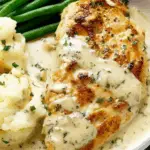 Creamy Ranch Chicken in skillet with sauce and potatoes