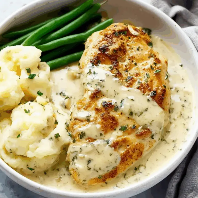 Creamy Ranch Chicken in skillet with sauce and potatoes