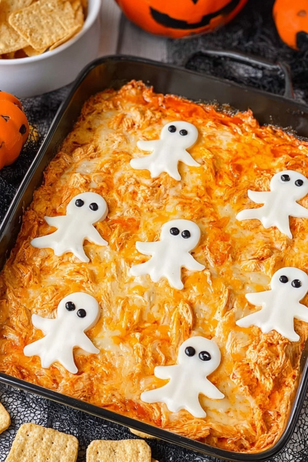 Halloween Buffalo Chicken Dip with spooky cheese ghosts