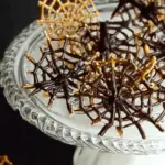 Halloween Chocolate Pretzel Spider Webs - A spooky and delicious Halloween treat