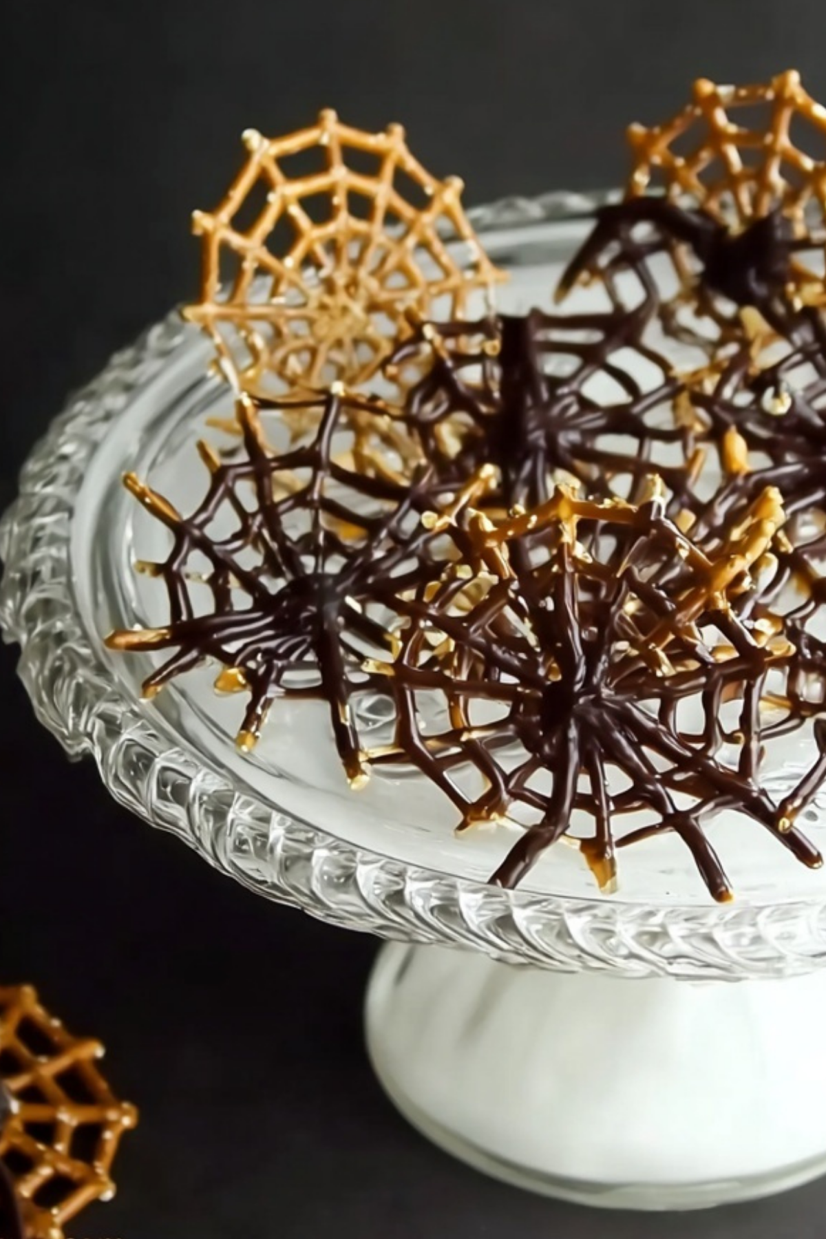 Halloween Chocolate Pretzel Spider Webs - A spooky and delicious Halloween treat