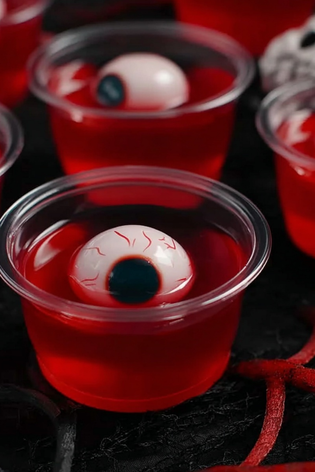 Halloween Eyeball Jello Shots recipe with spooky decorations