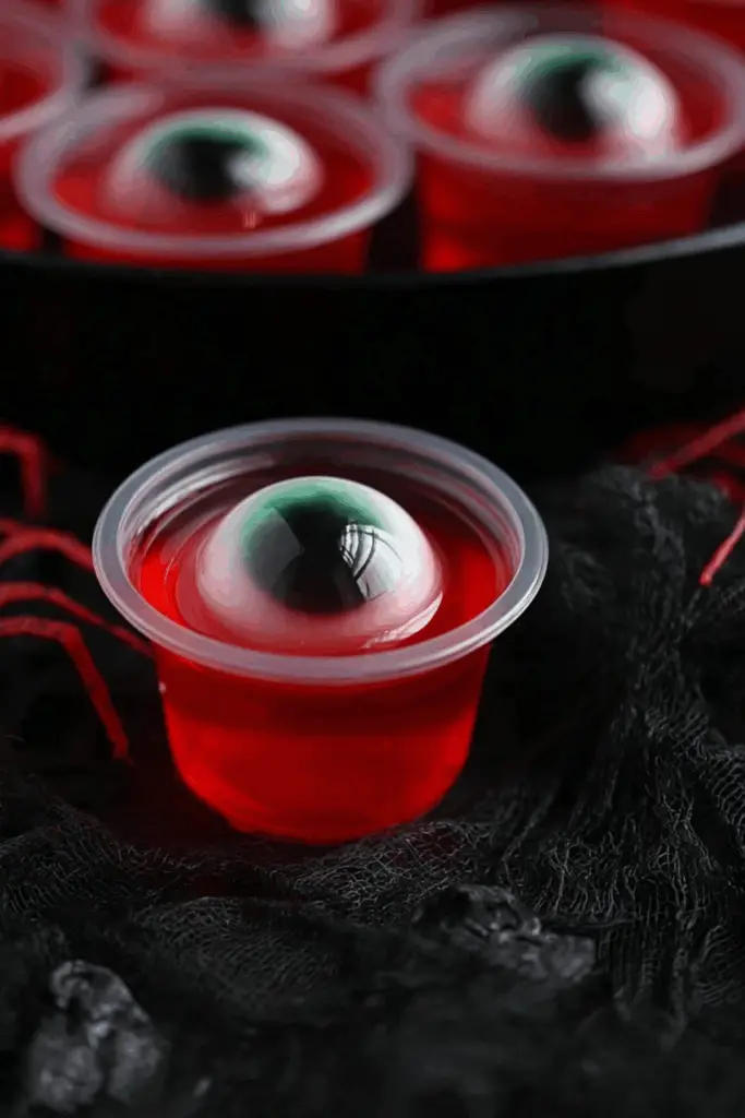 Halloween Eyeball Jello Shots recipe with spooky decorations