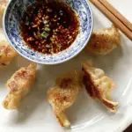 Japanese Gyoza Dipping Sauce in a bowl with dumplings