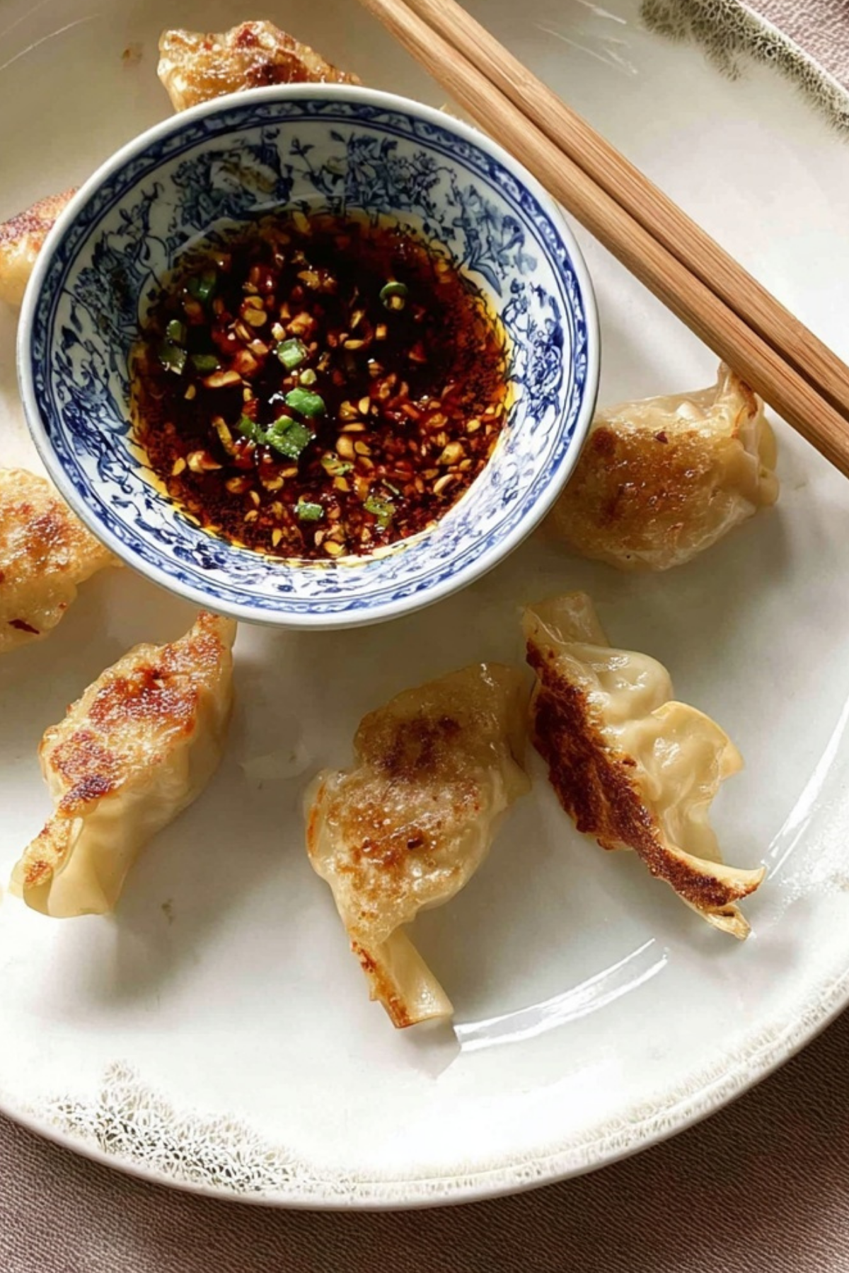 Japanese Gyoza Dipping Sauce in a bowl with dumplings